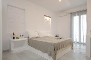 Кровать или кровати в номере Casa Verde Di Naxos