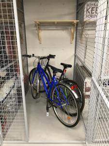 a blue bike is parked in a garage at Uusi kaksio satamassa, ilmainen parkkihalli in Kuopio +9 photos