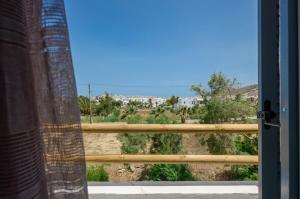 a view of a desert from a window at Casa Verde Di Naxos in Naxos Chora