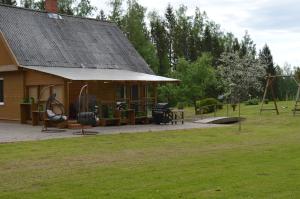 a building with a playground in a park at Piepilsēta in Alūksne