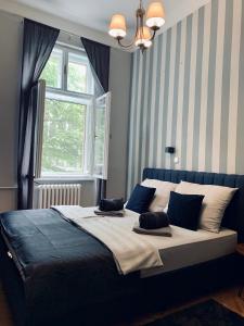 מיטה או מיטות בחדר ב-Apart Rooms Sova