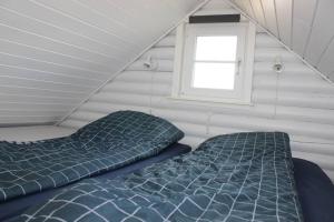 En eller flere senge i et værelse på Hyggely - A Place By The Sea - Nørre Lyngby