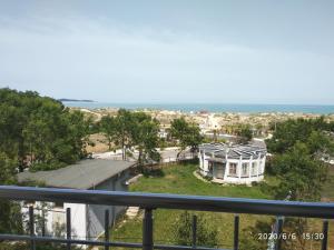 a view of the beach from the balcony of a house at Apartment Stoyanovi in Primorsko