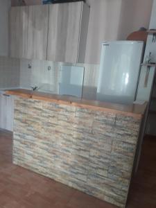 a kitchen with a stone counter top in a room at Luštica Mirište in Lustica