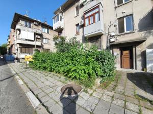 a shadow of a person standing in front of a building at Danny apartment in Burgas City