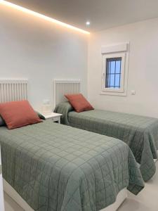 Un ou plusieurs lits dans un hébergement de l'établissement Apartamento Playas del Duque - Puerto Banús - Marbella