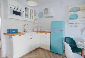 Kuchyň nebo kuchyňský kout v ubytování Apartamenty Piaskowe B21 z tarasem na dachu