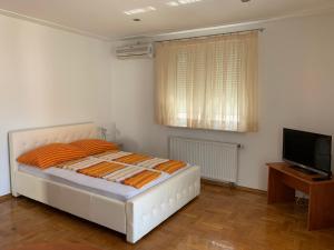 Postel nebo postele na pokoji v ubytování Apartments Dumančić