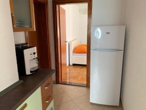 Kuchyň nebo kuchyňský kout v ubytování Apartments Dumančić