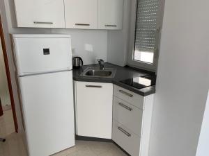 Kuchyň nebo kuchyňský kout v ubytování Apartments Dumančić