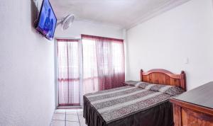 Postel nebo postele na pokoji v ubytování Hotel Plaza Aleman