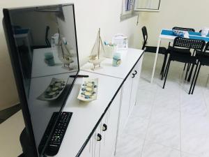 Televízia a/alebo spoločenská miestnosť v ubytovaní Playa Vacation House