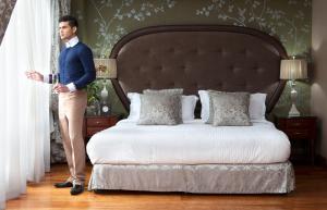 Voodi või voodid majutusasutuse Hotel Celeste Makati toas