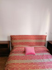 Łóżko lub łóżka w pokoju w obiekcie Ortensia - Sanremo Apartments