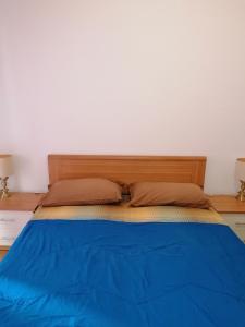 Łóżko lub łóżka w pokoju w obiekcie Ortensia - Sanremo Apartments