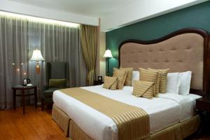 Voodi või voodid majutusasutuse Hotel Celeste Makati toas
