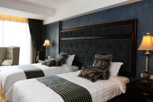 Voodi või voodid majutusasutuse Hotel Celeste Makati toas
