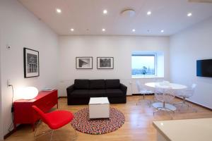 a living room with a couch and a table at Europahuset Apartments in Copenhagen