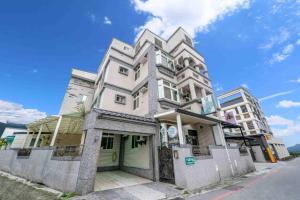 a building that is sitting on the side of a street at Wind Blown Homestay in Hualien City