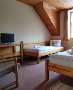 Postel nebo postele na pokoji v ubytování hotel ZLATÝ POTOK
