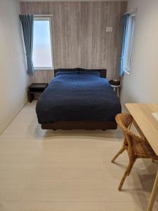 Postel nebo postele na pokoji v ubytování Port House Shibuya