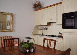 A kitchen or kitchenette at My Suite Home - Riva del Garda