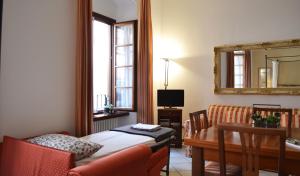 A television and/or entertainment centre at My Suite Home - Riva del Garda