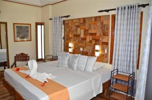 Postel nebo postele na pokoji v ubytování Calou Guest House