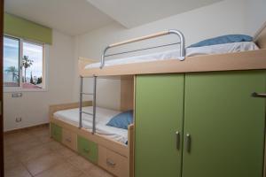 a bunk bed with two bunk beds in a room at Casa Ocean by MarCalma in Montroig +45 photos
