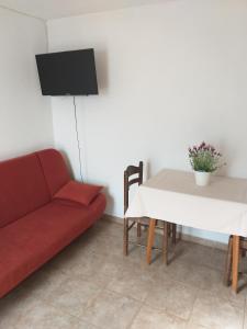 A television and/or entertainment centre at Apartment Ante K A1