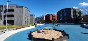 a playground in the middle of a city at Dream Stay - Brand New Apartment with Balcony & Free Parking in Tallinn