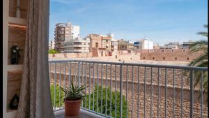 a balcony with a view of a city at Apartamento precioso a dos minutos de la playa in Santa Pola