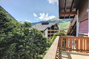 a balcony of a house with a view of a mountain at Marie-Rose 8 in Bagnes