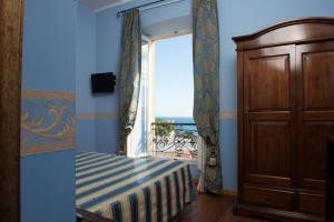 Postel nebo postele na pokoji v ubytování Hotel Belle Epoque + 37 fotografií