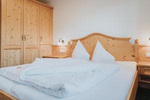 Postel nebo postele na pokoji v ubytování Hotel Silberfux
