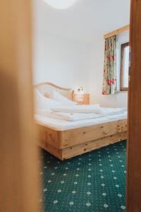 Postel nebo postele na pokoji v ubytování Hotel Silberfux