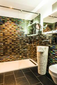 a bathroom with a shower and a toilet at Jagdschloss Windenhütte in Thale