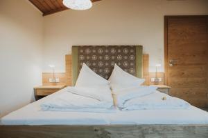 Postel nebo postele na pokoji v ubytování Hotel Silberfux
