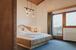 Postel nebo postele na pokoji v ubytování Hotel Silberfux