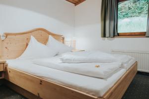 Postel nebo postele na pokoji v ubytování Hotel Silberfux