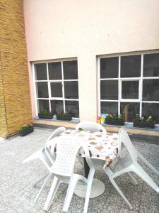 a white table and chairs on a patio at Dvosoban stan in Užice