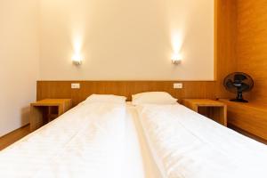 
Ein Bett oder Betten in einem Zimmer der Unterkunft Hotel & Lounge by Hyve Basel SBB
