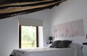 En eller flere senger på et rom på Casa Rural Ventanas a la Sierra