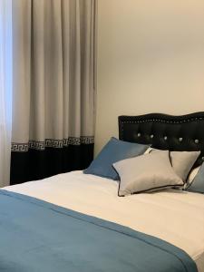 Voodi või voodid majutusasutuse Apartament Jantarowe Zacisze Green toas