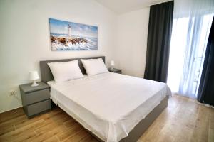Posteľ alebo postele v izbe v ubytovaní Piscina Apartments + 29 fotografií