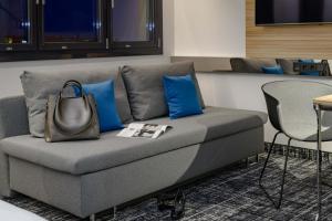 a living room filled with furniture and a couch at Novotel Suites Berlin City Potsdamer Platz in Berlin