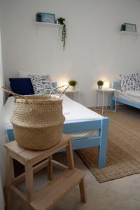 a room with a table and a basket on a stool at Casa di Felicita in Biograd na Moru +39 photos