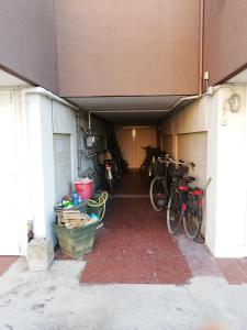 a group of bikes parked in a garage at Villa Manuela in Grado