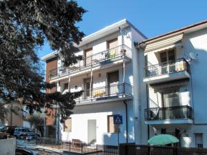 an apartment building with balconies on a street at Apartment Cipressi by Interhome in San Lorenzo al Mare