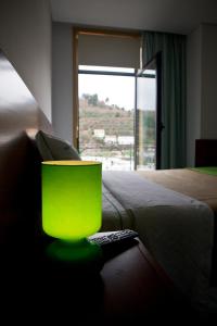 Uma cama ou camas num quarto em Hotel Comércio